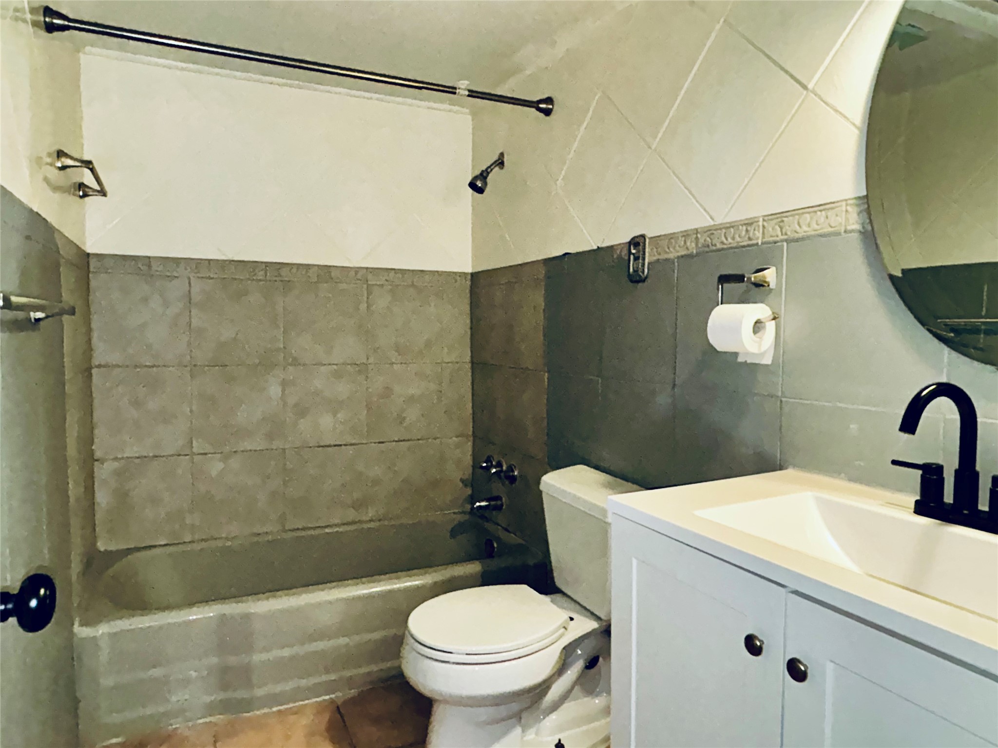 7825 Rue St Cyr Street, Unit 53 Houston, TX 77074 - Photo 8 of 11 a bathroom with a sink a toilet and shower