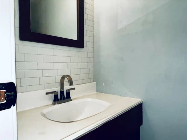 a close view of a sink and a mirror