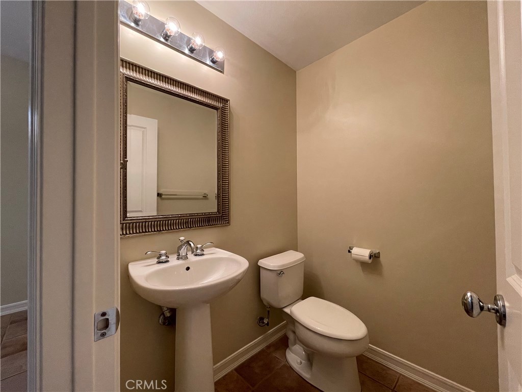 20 Arborside Irvine, CA 92603 - Photo 11 of 36 a bathroom with a toilet sink and mirror