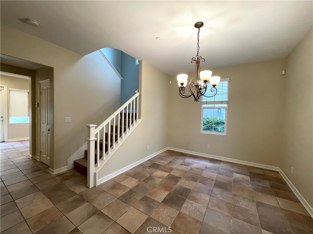 20 Arborside Irvine, CA 92603 - Photo 16 of 36 a view of a hallway with windows and chandelier