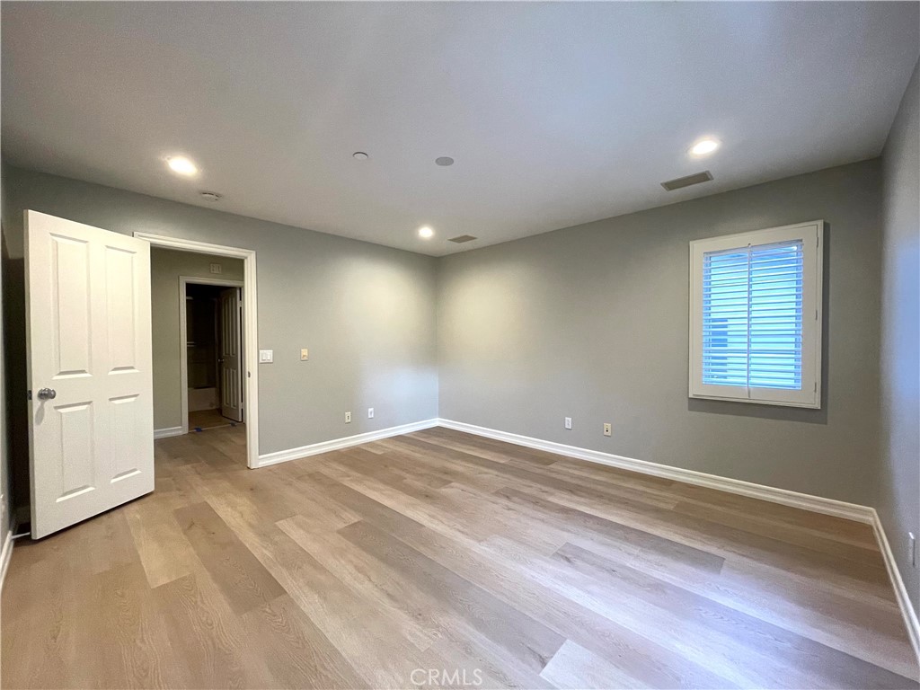 20 Arborside Irvine, CA 92603 - Photo 18 of 36 a view of empty room with wooden floor