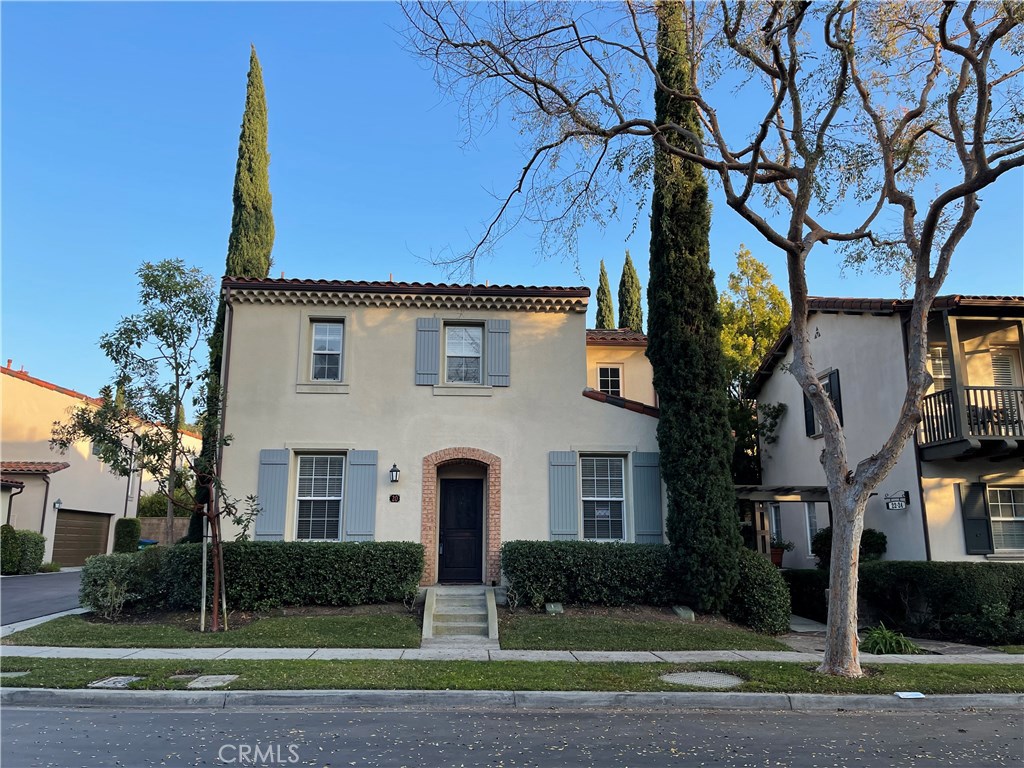 20 Arborside Irvine, CA 92603 - Photo 2 of 36 a front view of a house with a yard