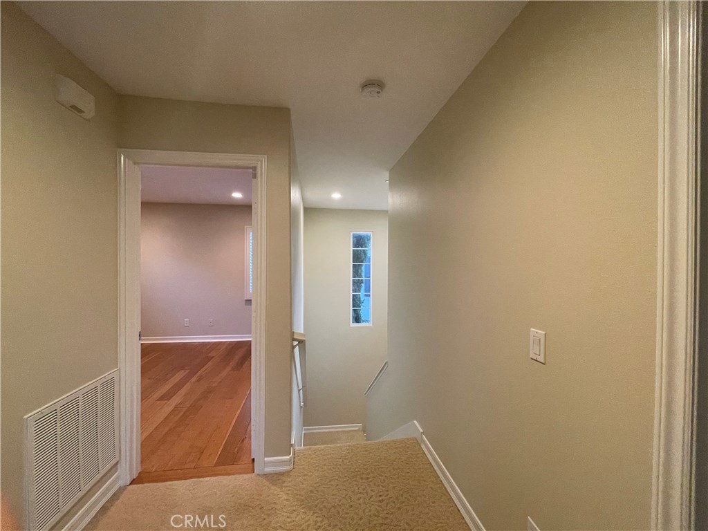 20 Arborside Irvine, CA 92603 - Photo 28 of 36 an empty room with an entrance to other room