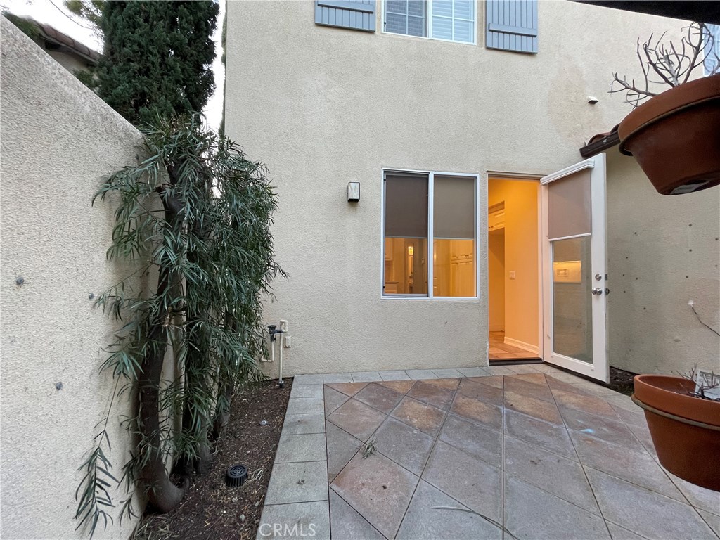 20 Arborside Irvine, CA 92603 - Photo 35 of 36 a front view of a house with plants