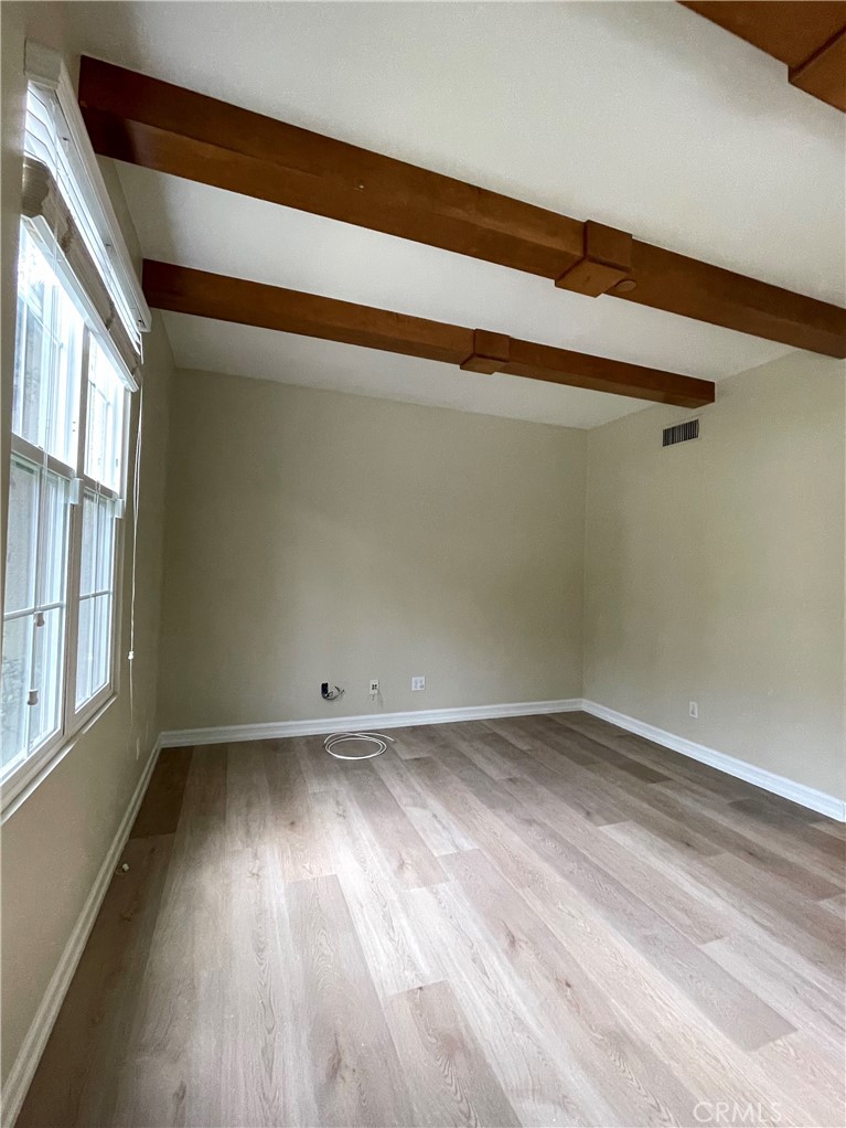 20 Arborside Irvine, CA 92603 - Photo 6 of 36 a view of empty room with wooden floor and fan