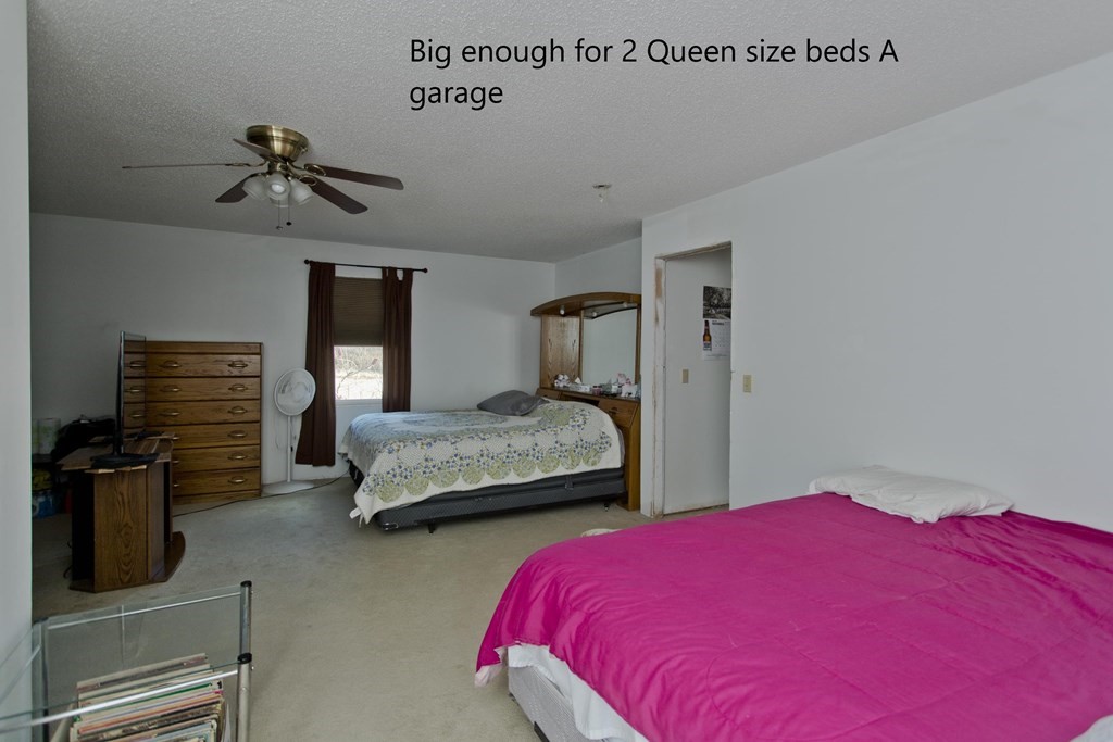 860 Plumtree Road Springfield, MA 01109 - Photo 18 of 21 a bedroom with a bed and wooden floor