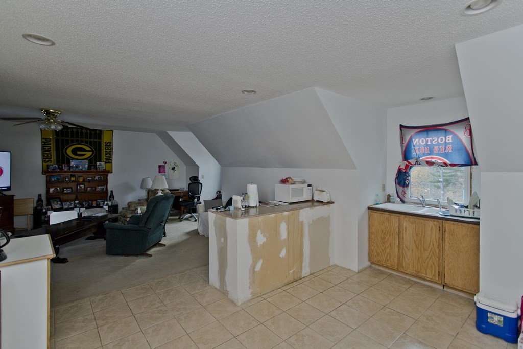860 Plumtree Road Springfield, MA 01109 - Photo 20 of 21 a kitchen with stainless steel appliances granite countertop a stove and a refrigerator
