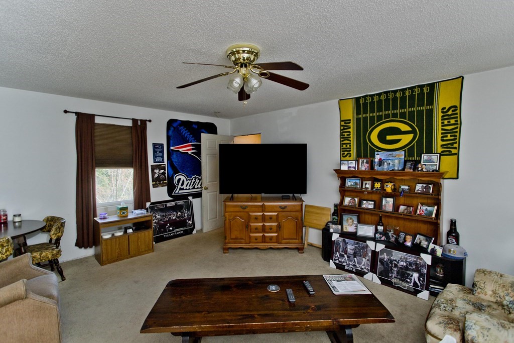 860 Plumtree Road Springfield, MA 01109 - Photo 21 of 21 a room with gym equipment and a flat screen tv