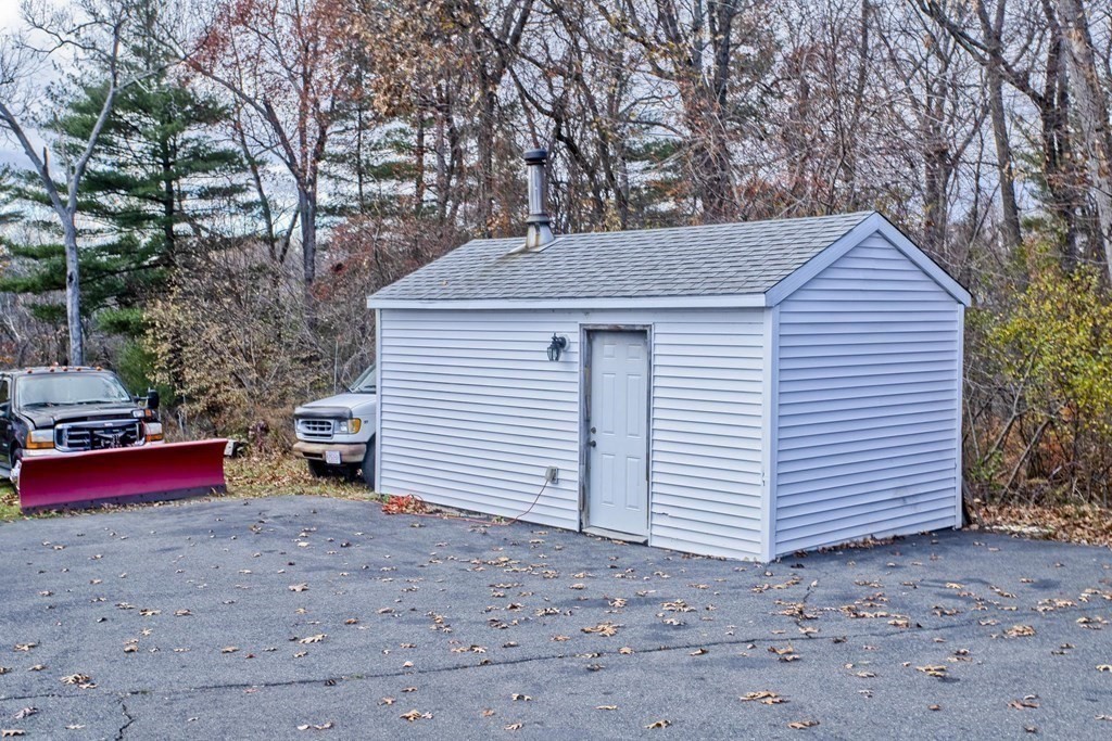860 Plumtree Road Springfield, MA 01109 - Photo 5 of 21 a house with trees in the background