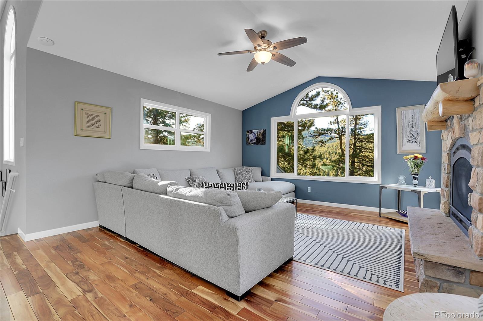 32857 Little Cub Road Evergreen, CO 80439 - Photo 12 of 47 a living room with furniture and a large window