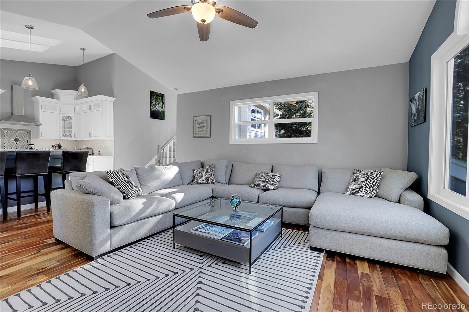 32857 Little Cub Road Evergreen, CO 80439 - Photo 12 of 47 a living room with furniture and a wooden floor