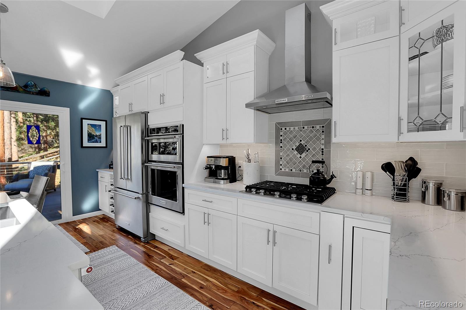 32857 Little Cub Road Evergreen, CO 80439 - Photo 14 of 47 a kitchen with stainless steel appliances a sink stove and refrigerator