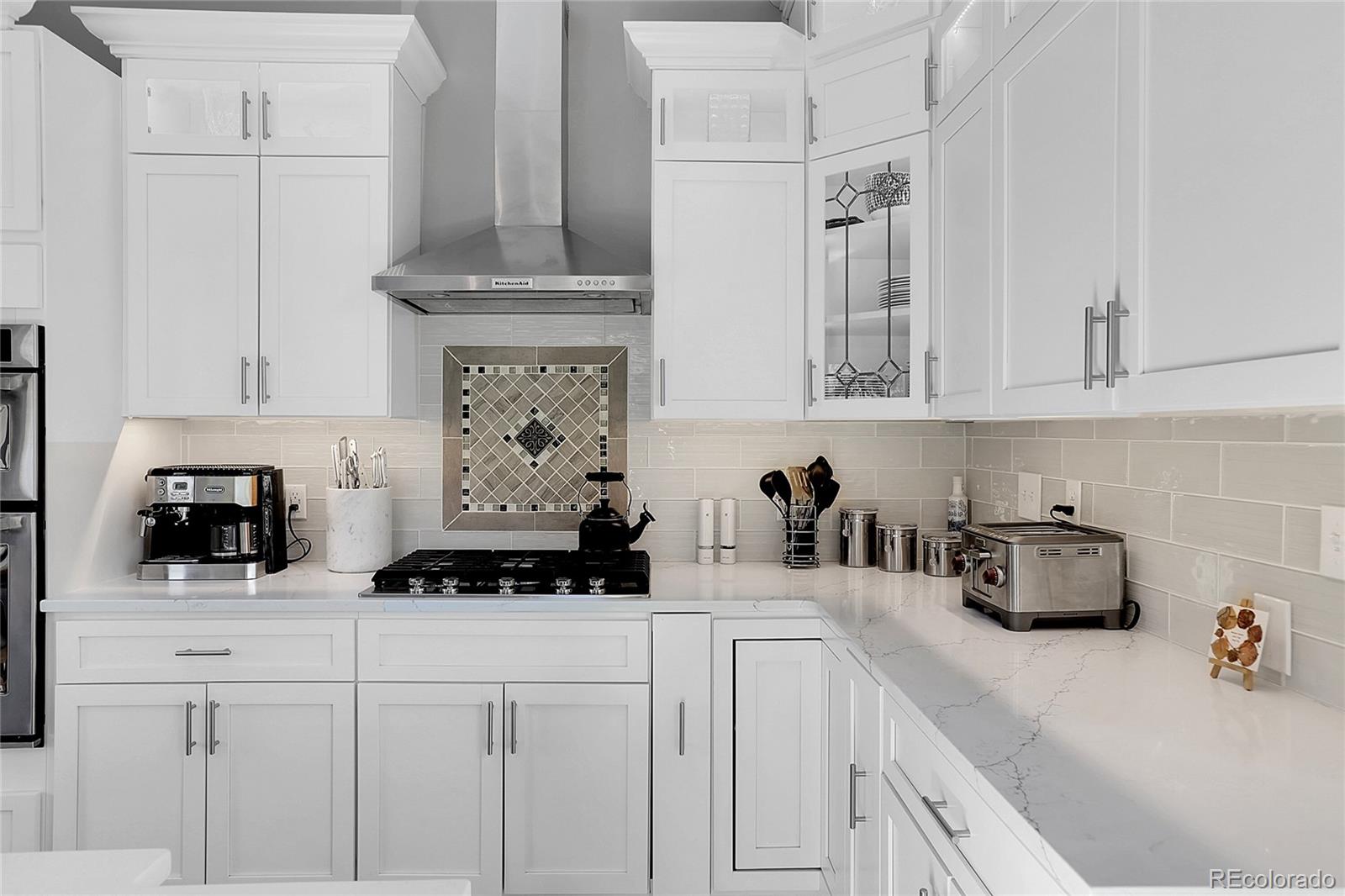 32857 Little Cub Road Evergreen, CO 80439 - Photo 15 of 48 a kitchen with stainless steel appliances a sink a stove and cabinets
