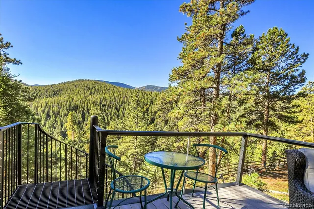 a view of a chairs and table on the wooden floor