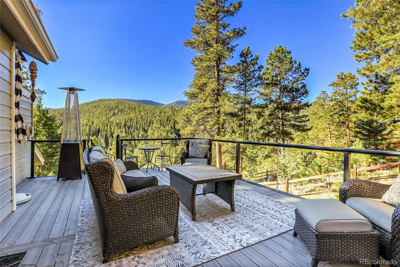 32857 Little Cub Road Evergreen, CO 80439 - Photo 22 of 48 a view of a chairs in a balcony