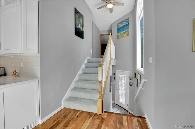 a view of entryway with wooden floor and stairs