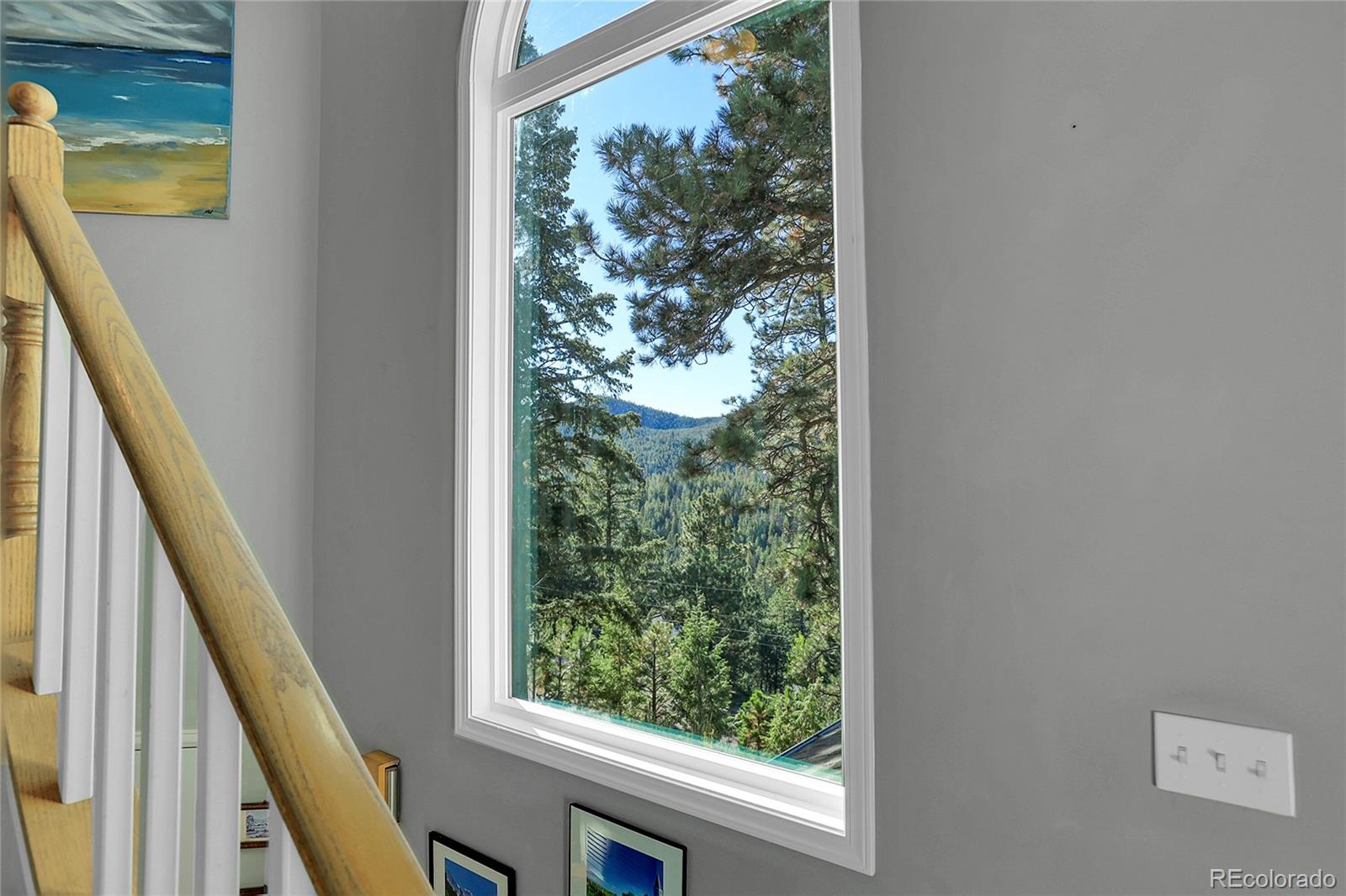 32857 Little Cub Road Evergreen, CO 80439 - Photo 26 of 48 a view of a balcony with wooden floor and stairs
