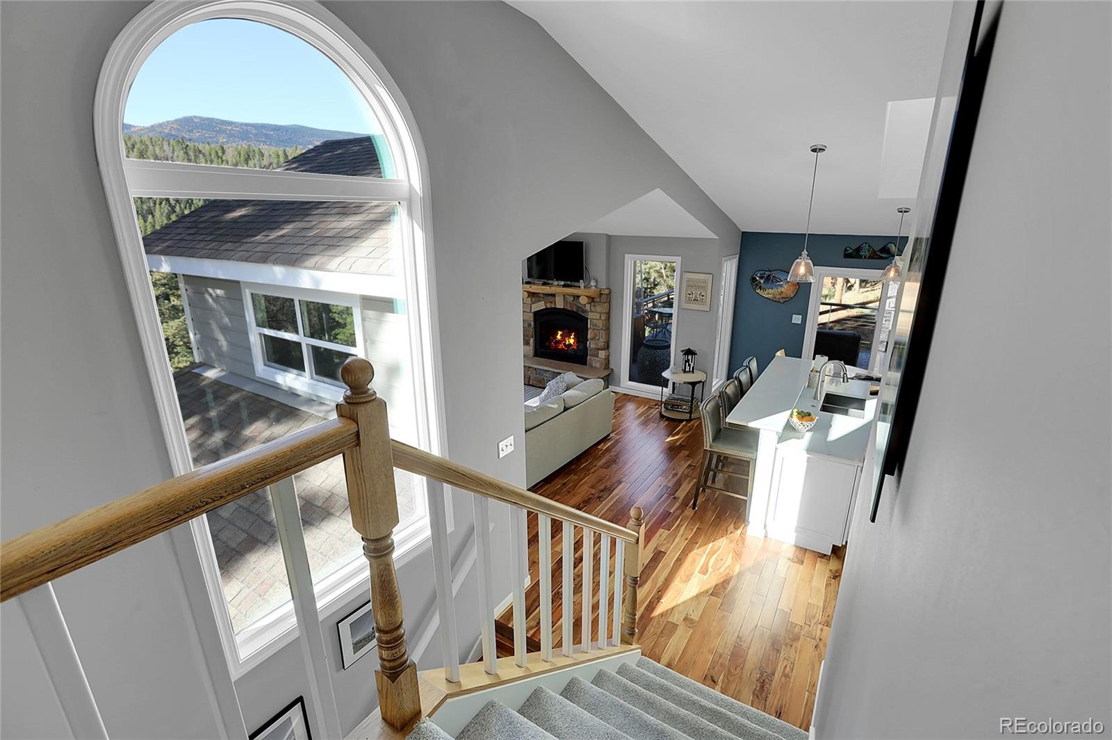 32857 Little Cub Road Evergreen, CO 80439 - Photo 26 of 47 a view of an entryway with wooden floor