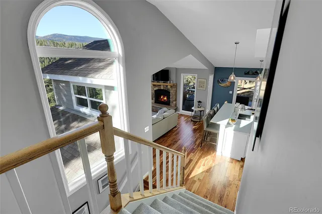 a view of an entryway with wooden floor