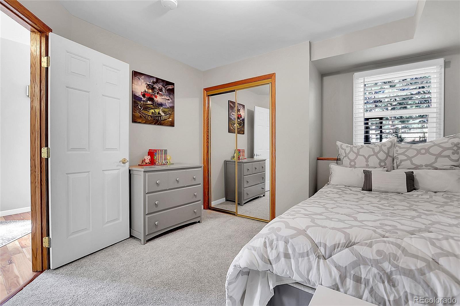 32857 Little Cub Road Evergreen, CO 80439 - Photo 39 of 48 a bedroom with a bed and a window