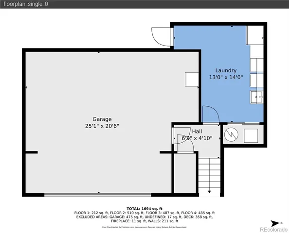 a street sign on a road next to a building