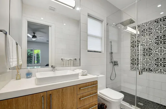 a bathroom with a sink toilet and shower