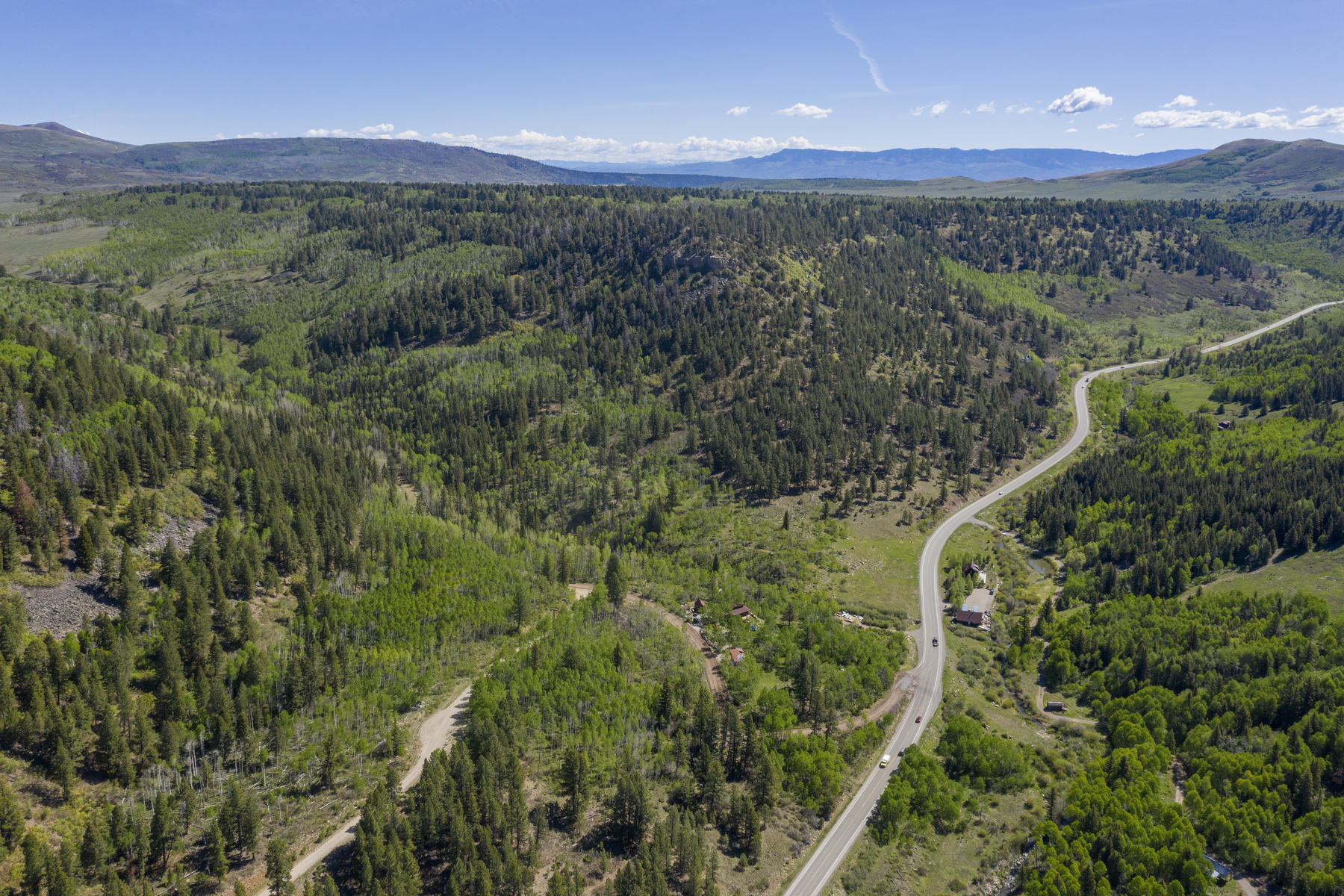 Lot 1 Sky Mountain Ranch Road Placerville, CO 81430 - Photo 3 of 13 a view of a city with lush green forest