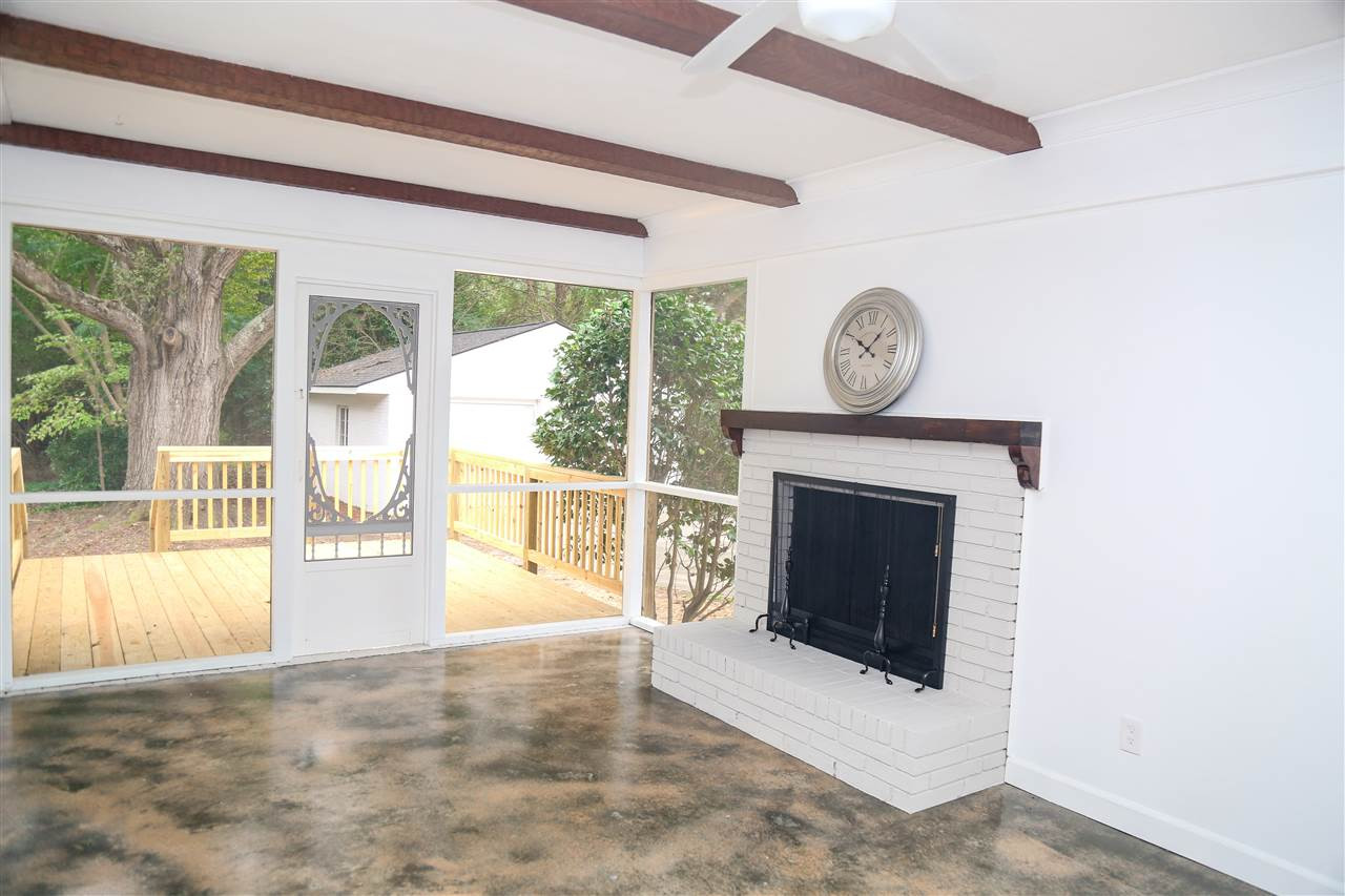 2910 Haven Road Raleigh, NC 27610 - Photo 23 of 25 Screened porch with fireplace