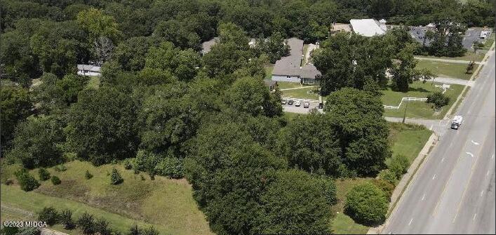 5885 Houston Road Macon, GA 31216 - Photo 1 of 1 an aerial view of residential house with outdoor space and trees all around