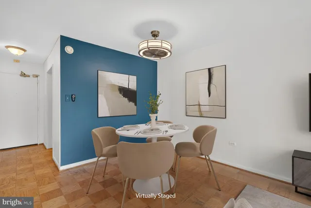 a dining room with furniture and window