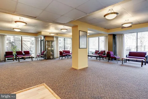 a living room with furniture and a table