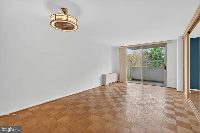 a view of empty room with windows