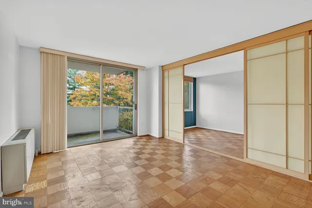 a view of an empty room with a window