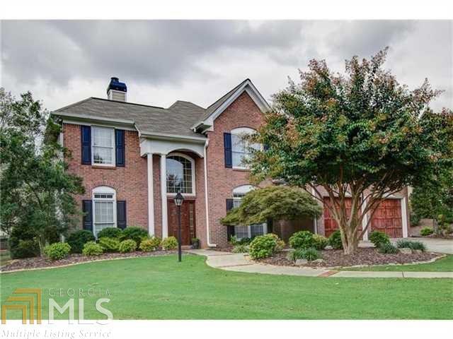 Beautiful Brick Beauty in the heart of the cul de sac in Amenities Rich Olde Atlanta Club! This home is located a short walk away from the Sportspark Area!  Level Yard, Level Driveway, and LARGE Fenced in Backyard! Perfect for the whole family includ