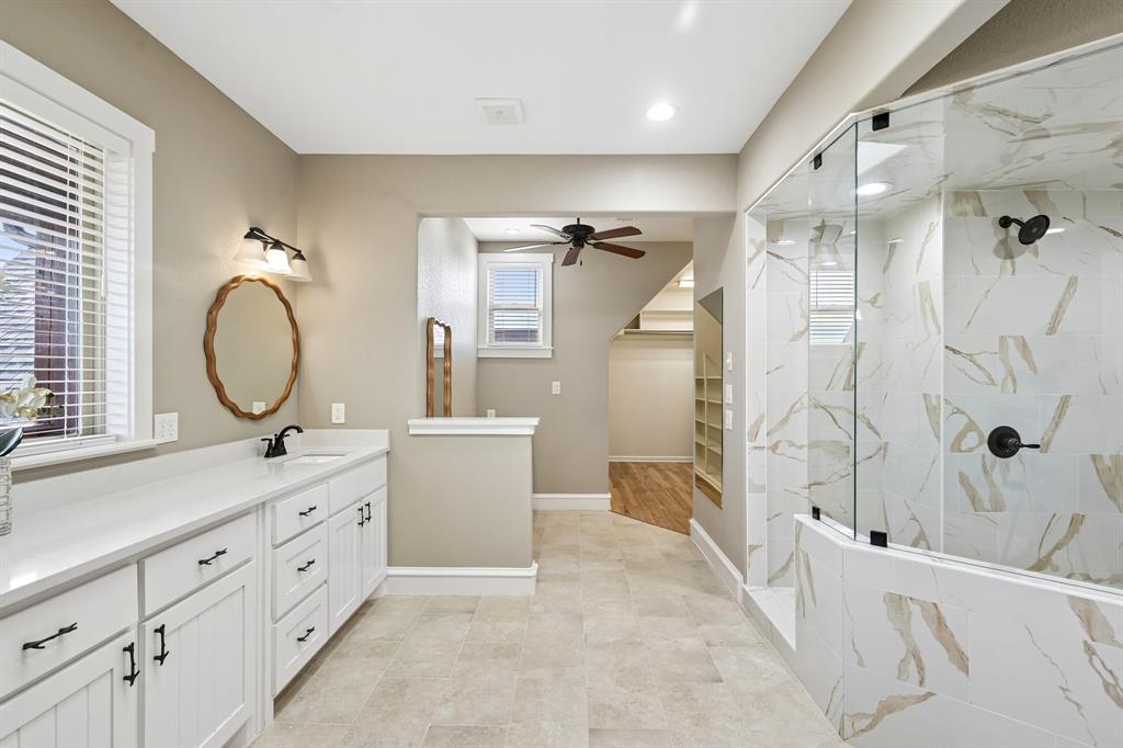 2085 Switzer Road Sanger, TX 76266 - Photo 17 of 39 Spacious bathroom featuring a white vanity with dual sinks and matte black fixtures