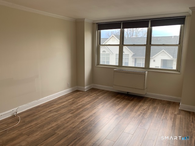 50 Glenbrook Road, Unit 5G Stamford, CT 06902 - Photo 31 of 40 an empty room with wooden floor and windows