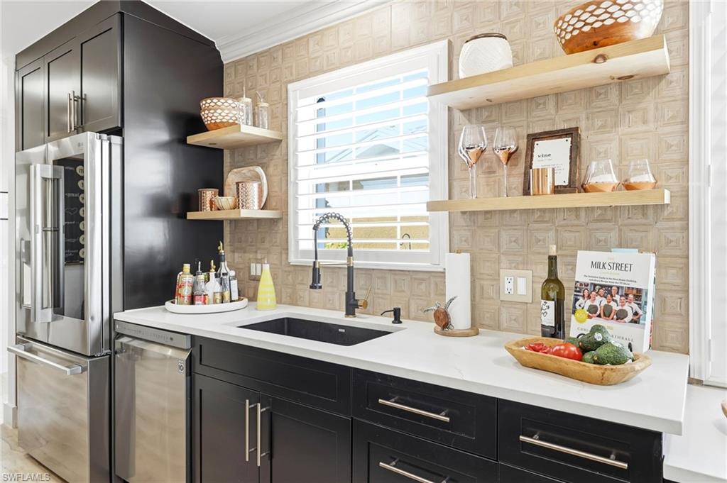 7575 Novara Court Naples, FL 34114 - Photo 14 of 49 Beautifully remodeled kitchen with stylish backsplash