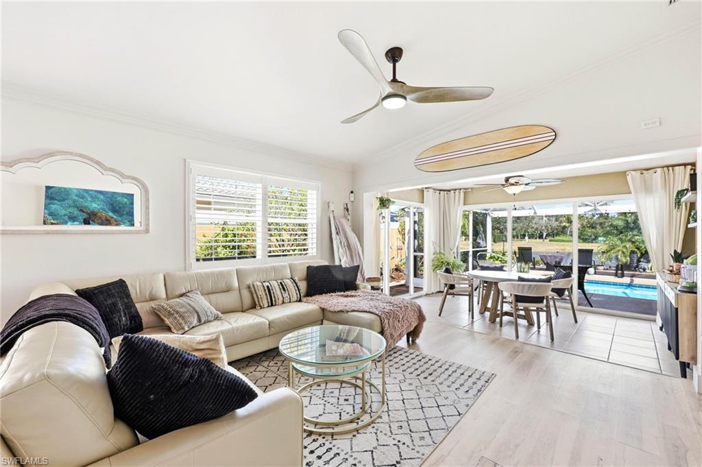 7575 Novara Court Naples, FL 34114 - Photo 20 of 49 Extended Living Room with Dining Area