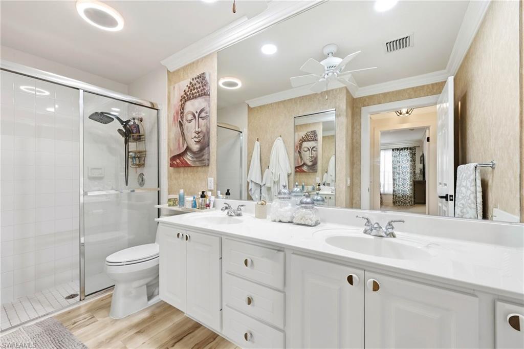 7575 Novara Court Naples, FL 34114 - Photo 26 of 49 Master Bathroom with dual sinks and updated flooring