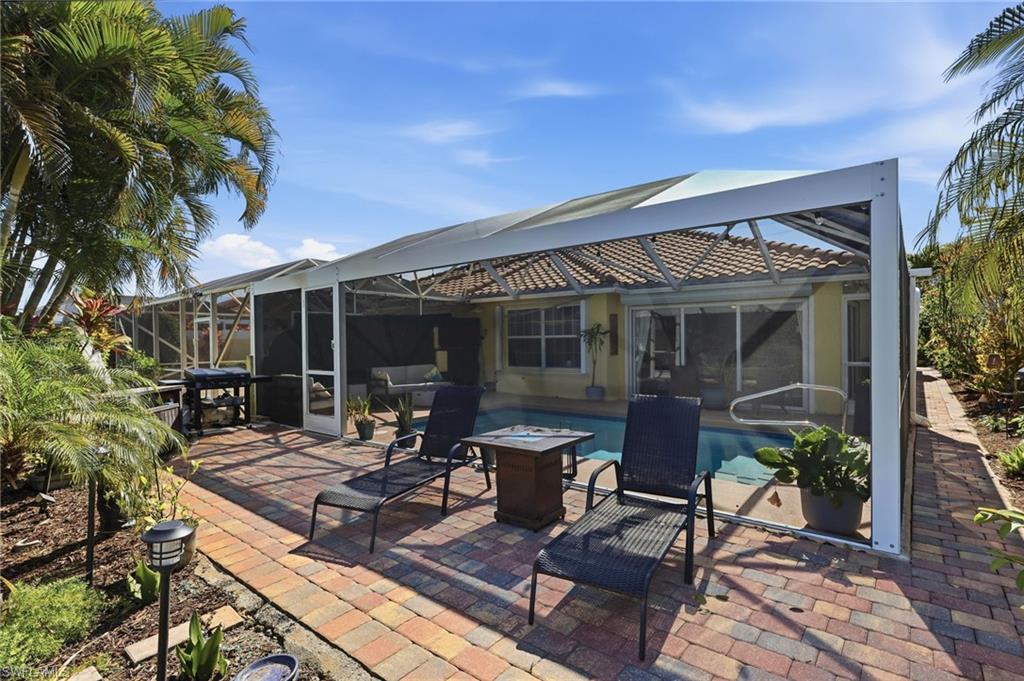 7575 Novara Court Naples, FL 34114 - Photo 8 of 49 Additional outdoor Sun Deck with Brick pavers space with Grille