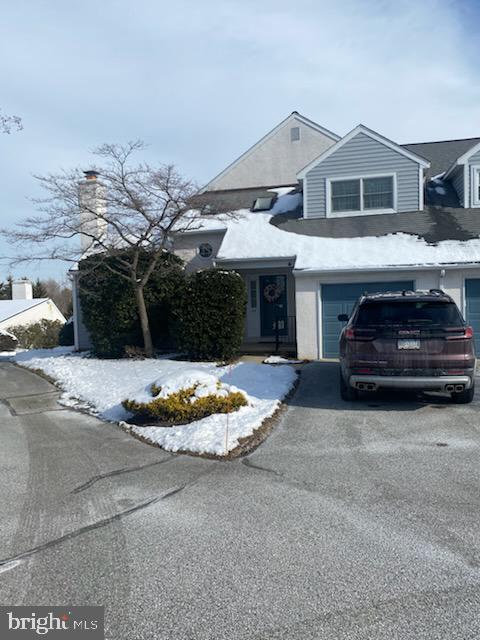 43 Hunters Run Newtown Square, PA 19073 - Photo 2 of 37 a front view of a house with a yard and garage