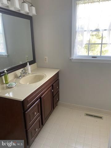 43 Hunters Run Newtown Square, PA 19073 - Photo 27 of 37 a bathroom with a sink vanity and a mirror