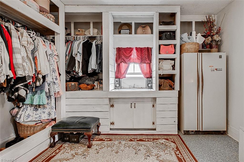 303 Coleridge Road Ramseur, NC 27316 - Photo 16 of 36 Primary Closet/Mud room/Laundry-Built in Shelving and sink