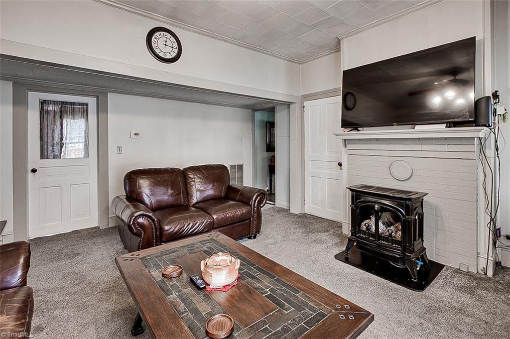 303 Coleridge Road Ramseur, NC 27316 - Photo 3 of 36 Living Room with Propane Insert