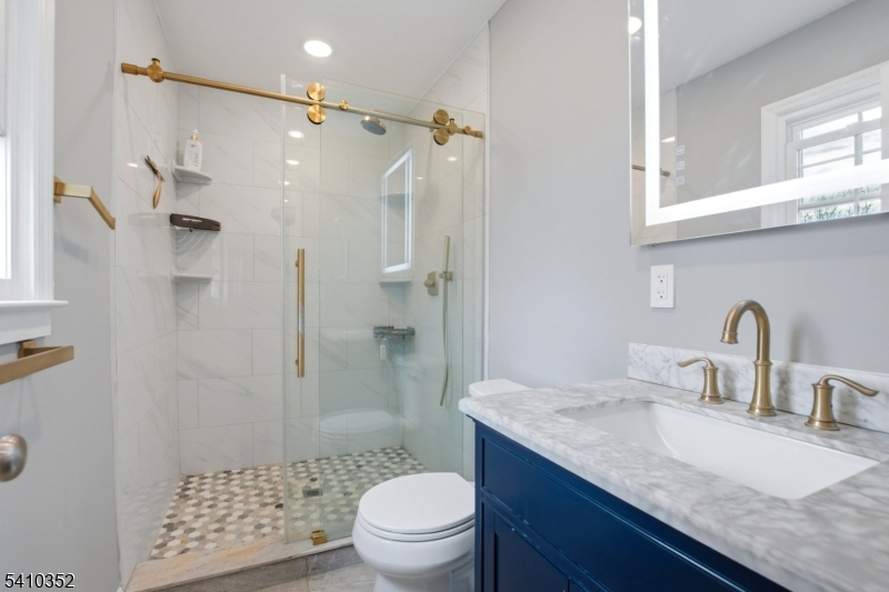 31 Blue Ridge Avenue Green Brook, NJ 08812 - Photo 15 of 28 a bathroom with a granite countertop sink toilet and shower
