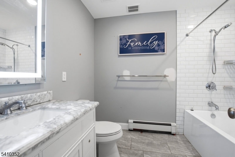 31 Blue Ridge Avenue Green Brook, NJ 08812 - Photo 16 of 28 a bathroom with a granite countertop sink a toilet and bathtub