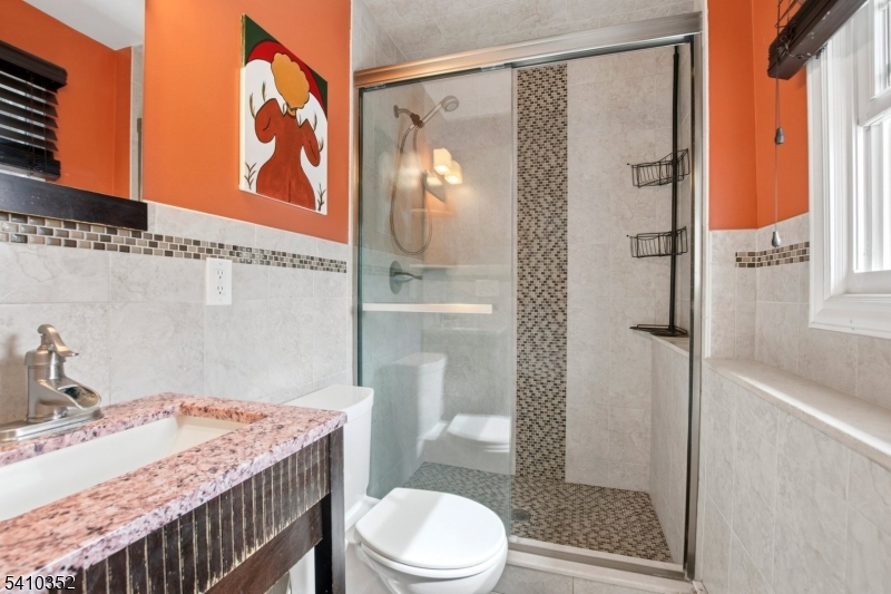 31 Blue Ridge Avenue Green Brook, NJ 08812 - Photo 17 of 28 a bathroom with a sink toilet and shower