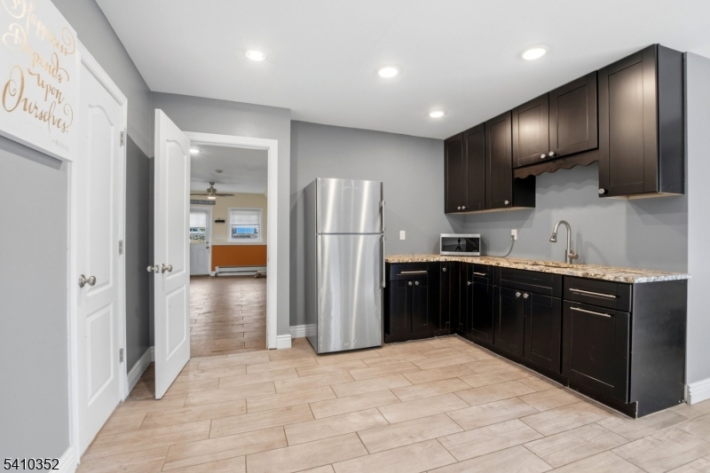 31 Blue Ridge Avenue Green Brook, NJ 08812 - Photo 18 of 28 a kitchen with stainless steel appliances kitchen island granite countertop a refrigerator and a sink
