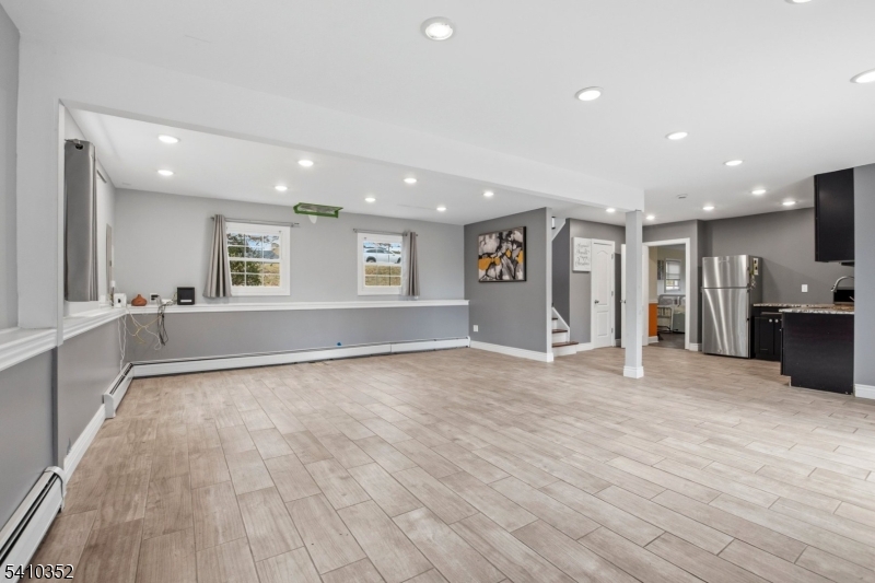 31 Blue Ridge Avenue Green Brook, NJ 08812 - Photo 20 of 28 a view of an empty room with window and wooden floor