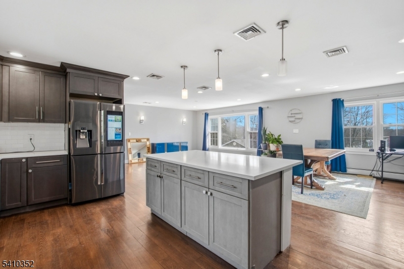 31 Blue Ridge Avenue Green Brook, NJ 08812 - Photo 2 of 28 a kitchen with stainless steel appliances granite countertop a refrigerator a stove and a wooden floors